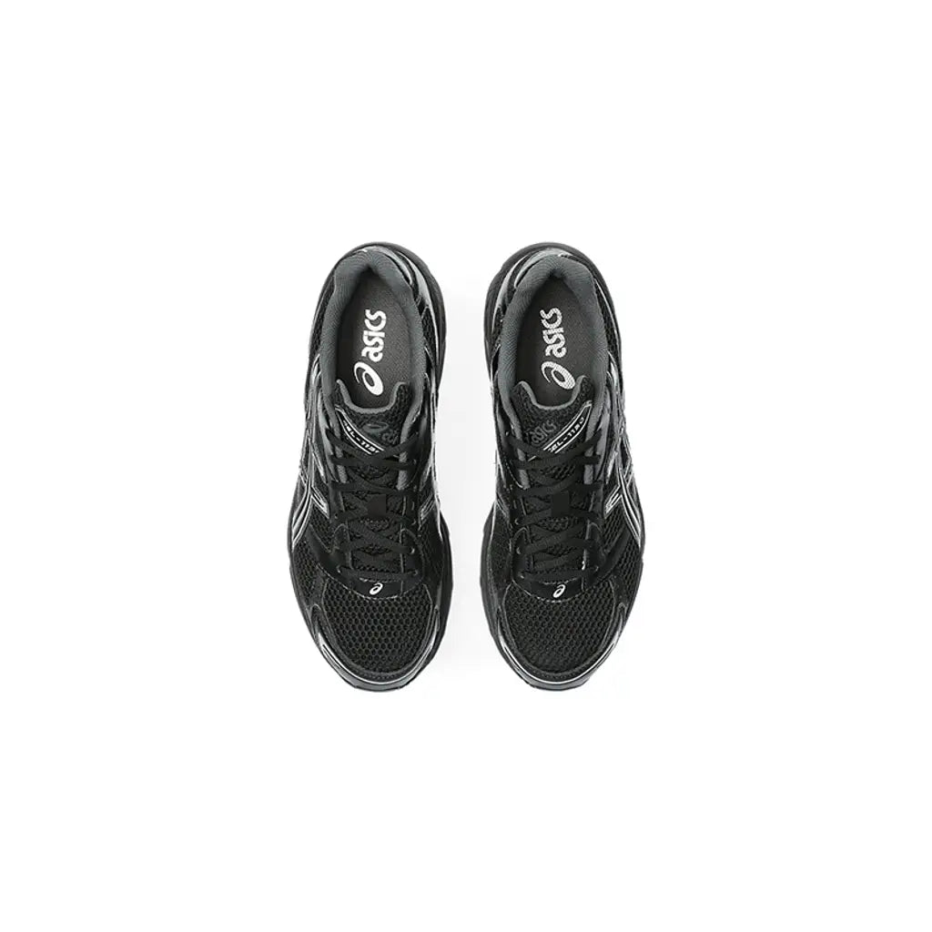 Black Asics running shoes on a white background