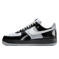 Black and white sneaker with a prominent Nike logo on a white background