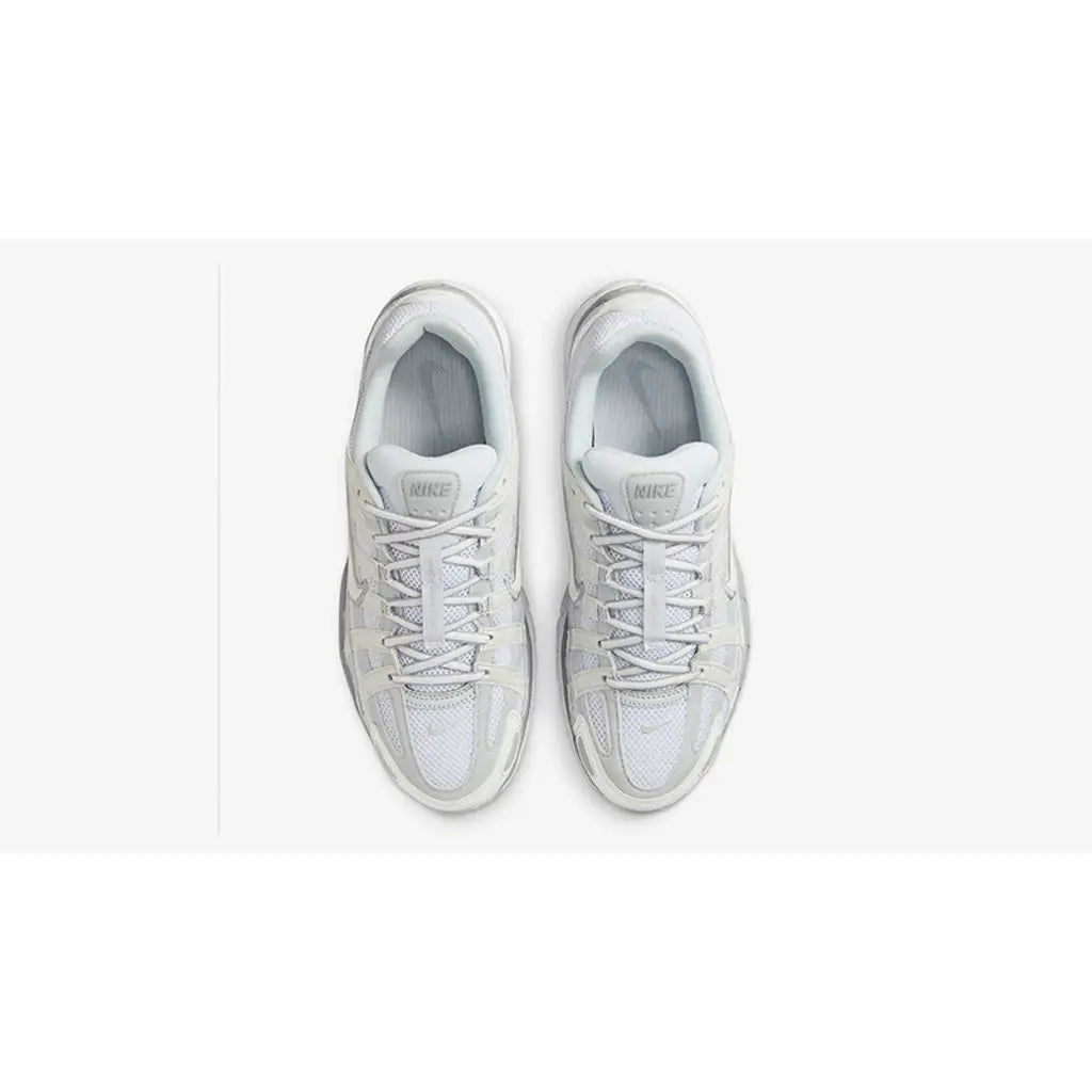 Pair of white sneakers on a white background