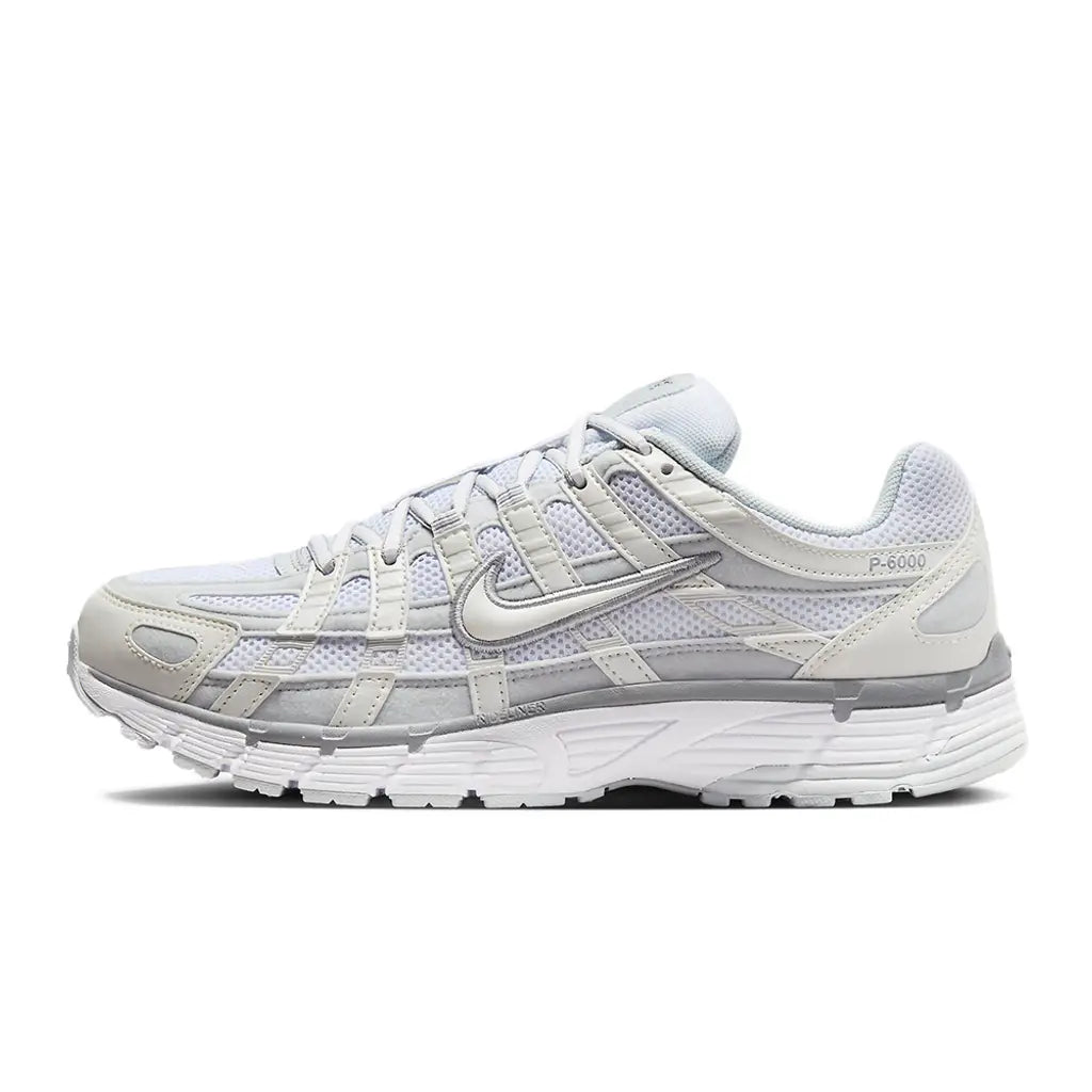 White running shoe with gray accents on a white background