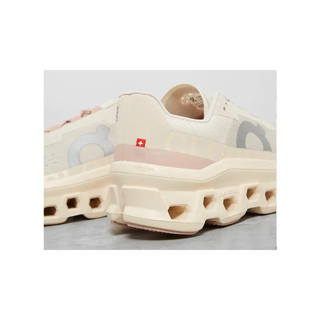 Beige sneaker with unique sole design on a light gray background