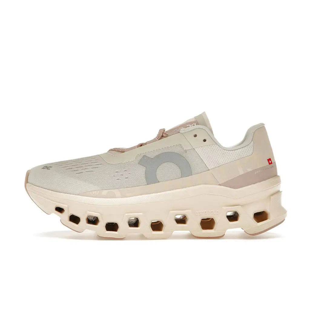 Beige running shoe with unique sole design on a white background