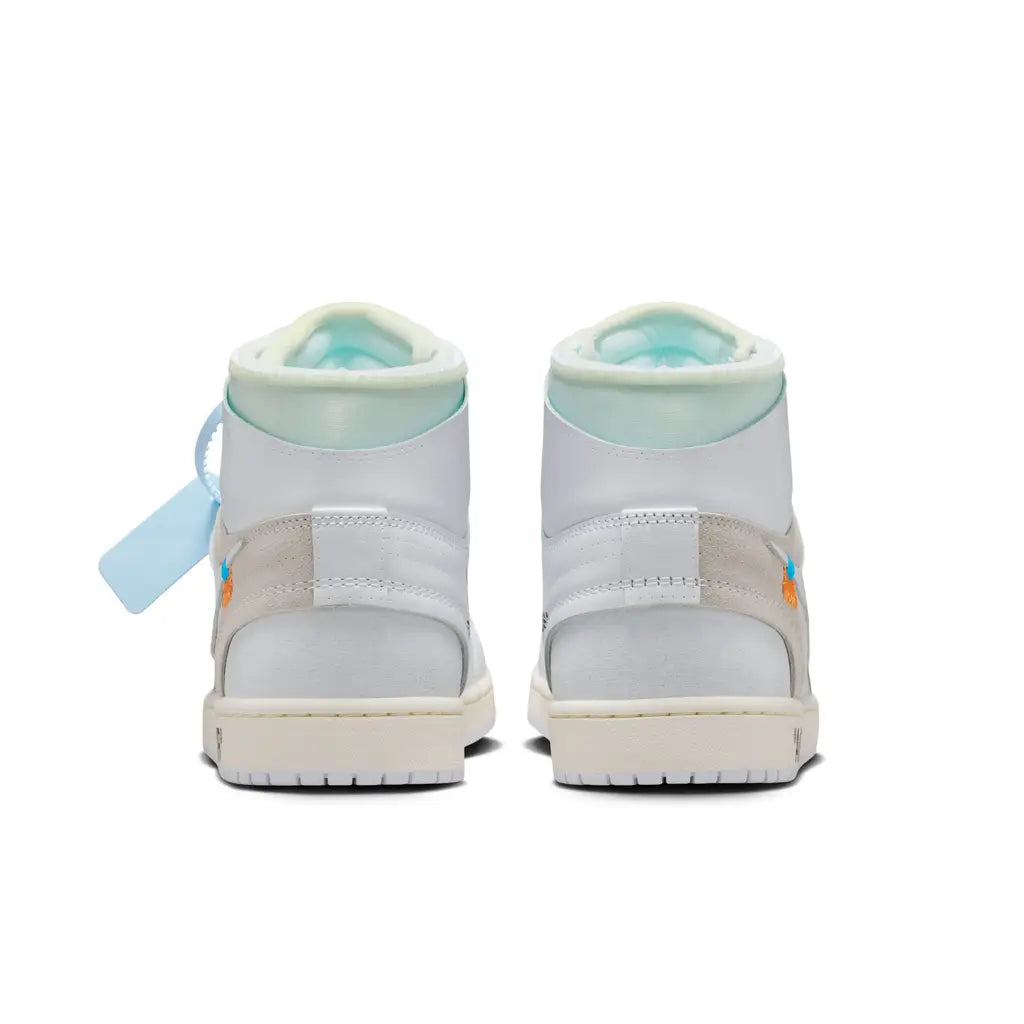 Pair of light gray high-top sneakers with a tag on a white background