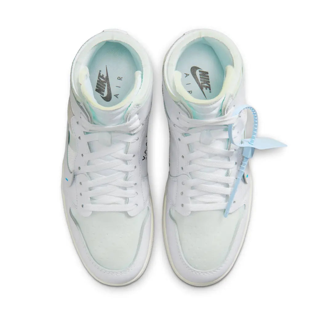White Nike sneakers with light blue accents on a white background